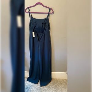 Francescas navy blue jumpsuit. Lace back with clasp and zipper. New with tags. M